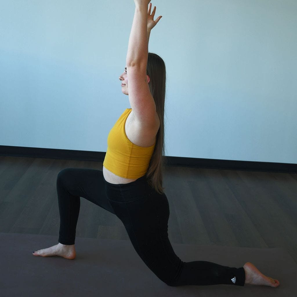 Citta Zoe Lowden performs a low lunge at Myriad Yoga