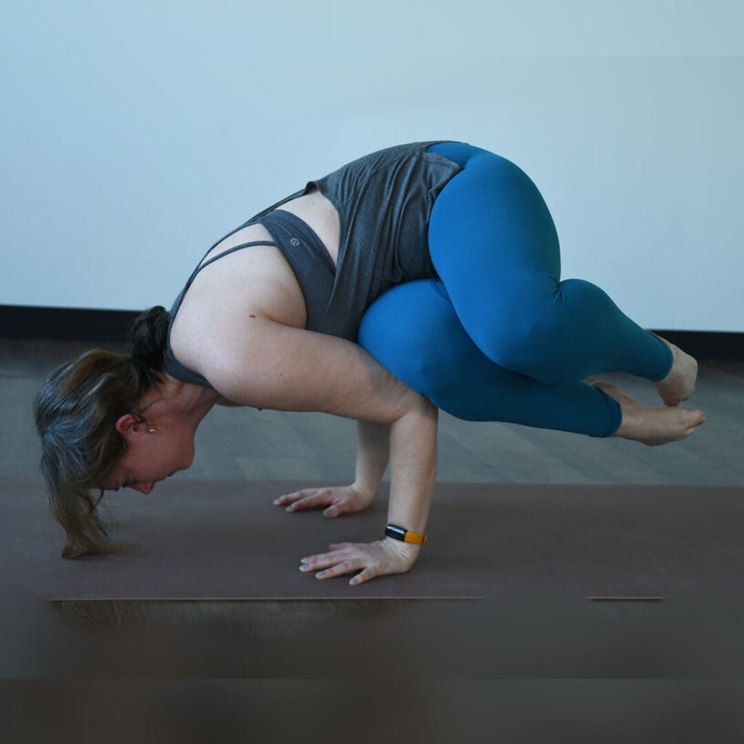 Audra Yovanovich practices side crow an example of abhyasa